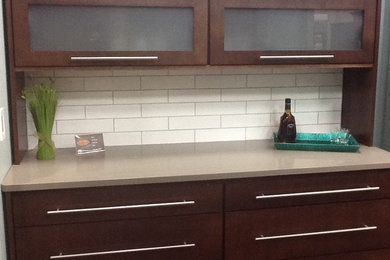 Example of an eat-in kitchen design in Other with white backsplash and porcelain backsplash