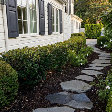 Side garden stepping-stone path and boxwood hedges in Atherton landscape
