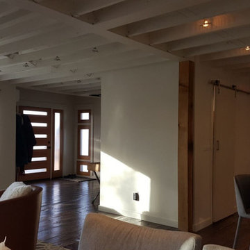 Modernize old two story home, expand over existing garage