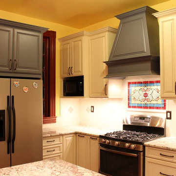 Traditional Galley Kitchen with Beige & Blue Cabinets and Chimney Hood