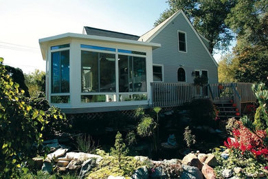 Inspiration for a timeless blue one-story vinyl gable roof remodel in Denver