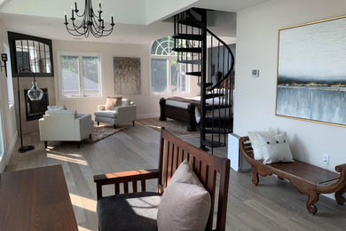 Inspiration for a contemporary master medium tone wood floor, gray floor and vaulted ceiling bedroom remodel in Boston with multicolored walls, a corner fireplace and a tile fireplace