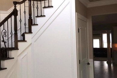 Staircase - large curved staircase idea in New York
