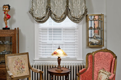 Inspiration for a french country medium tone wood floor and brown floor living room remodel in DC Metro with green walls