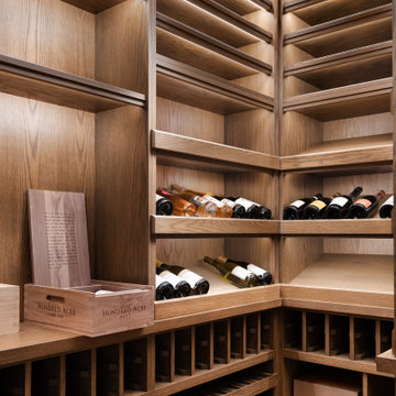 Modern Glass-Enclosed Wine Cellar with Custom Oak Racking | Chicago