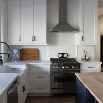White Shaker Farmhouse Kitchen with Maple Butcher Block Island