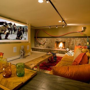 Home theater - eclectic home theater idea in Albuquerque with a projector screen