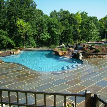 Delaware Township custom pool and raised spa with negative edge & water feature