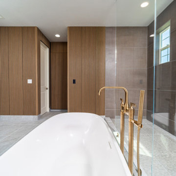 Elegant master bathroom with large format tile