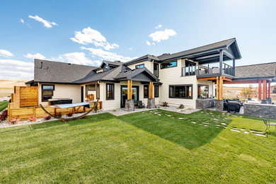 Example of a trendy beige two-story house exterior design in Columbus