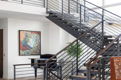 Staircase - huge modern tile metal railing staircase idea in Salt Lake City with metal risers