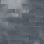 Merola Tile - Coco Glossy Blue Night Porcelain Wall Tile - Offering a subway look, our Coco Glossy Blue Night Porcelain Wall Tile features a smooth, glossy finish, providing decorative appeal that adapts to a variety of stylistic contexts. Containing 100 different print variations that are randomly distributed throughout each case, this blue rectangle tile offers a one-of-a-kind look. With its impervious, frost-resistant features, this tile is an ideal selection for both indoor and outdoor commercial and residential installations, including kitchens, bathrooms, backsplashes, showers, hallways and fireplace facades. This tile is a perfect choice on its own or paired with other products in the Coco Collection. Tile is the better choice for your space!