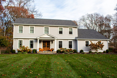 Inspiration for a gray clapboard exterior home remodel in New York