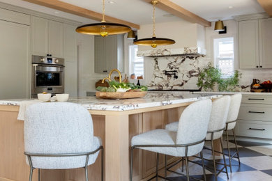 Example of a mid-sized transitional l-shaped marble floor, gray floor and exposed beam eat-in kitchen design in Vancouver with an undermount sink, shaker cabinets, green cabinets, marble countertops, white backsplash, ceramic backsplash, paneled appliances, an island and white countertops