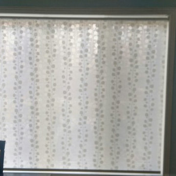 Patterned roller shade in a Toronto dining room