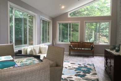 Design ideas for a large contemporary conservatory in Boston with porcelain flooring.