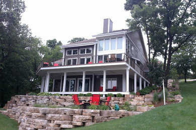 Example of a huge beach style brown two-story mixed siding exterior home design in Other