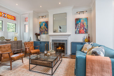 Eclectic formal living room in DC Metro with white walls, dark hardwood floors, a standard fireplace and no tv.