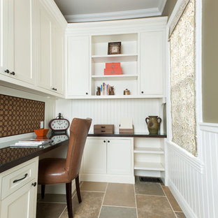 Photo of a transitional study room in New York with green walls, linoleum floors, a built-in desk and no fireplace.