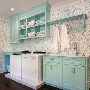 This is an example of a medium sized traditional single-wall separated utility room in Jacksonville with a built-in sink, beaded cabinets, turquoise cabinets, dark hardwood flooring, a side by side washer and dryer and white worktops.