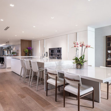 Modern Luxury Kitchen with Integrated Dining | Sleek White & Custom Details
