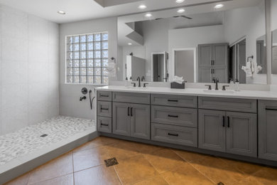 Example of a large trendy master white tile and porcelain tile double-sink bathroom design in Phoenix with shaker cabinets, gray cabinets, gray walls, an undermount sink, quartz countertops, white countertops, a niche and a built-in vanity