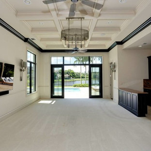 マイアミの巨大なトランジショナルスタイルのおしゃれなホームバー (家具調キャビネット、濃色木目調キャビネット、カーペット敷き、ベージュの床、オレンジのキッチンカウンター) の写真