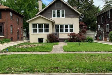 Mid-sized elegant multicolored three-story brick exterior home photo in Chicago with a shingle roof