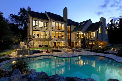 Inspiration for a beige three-story stone exterior home remodel in DC Metro