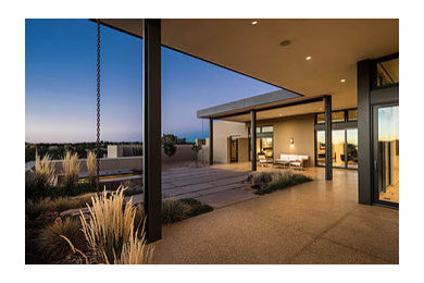 Inspiration for a southwestern beige one-story stucco exterior home remodel in Albuquerque