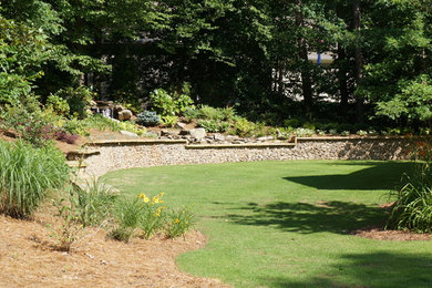Inspiration for a large traditional shade backyard retaining wall landscape in Atlanta for summer.