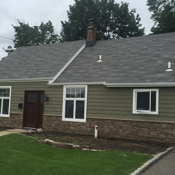 Levittown Siding - Arbor Shakes with Terra Rosa Ledgestone and Mahogany Door