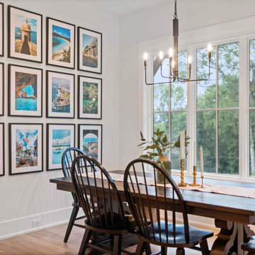 Elegant Modern Farmhouse Dining Room: Travel Gallery Wall, Rustic Table, and Pan