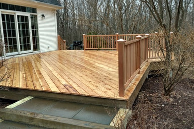 The finished cedar deck and rails shine in a light sleet!