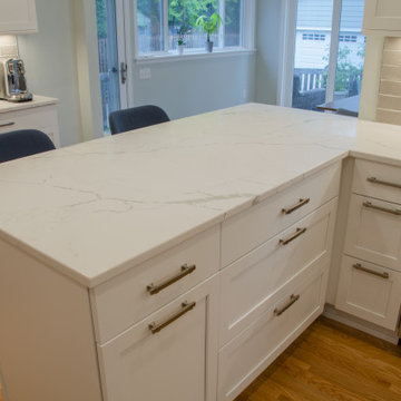 The Right Lights and White Quartz for a Bright Kitchen