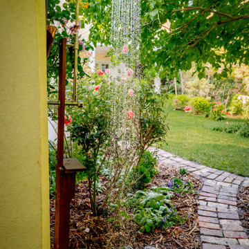 Outdoor Shower Along Curved Brick Garden Path