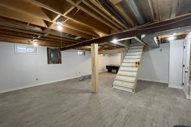 Basement - rustic basement idea in Toronto