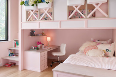 Kids' room - transitional girl light wood floor and beige floor kids' room idea in Chicago with pink walls