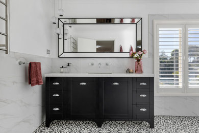 Inspiration for a large traditional 3/4 bathroom in Sydney with shaker cabinets, black cabinets, an open shower, a two-piece toilet, gray tile, white walls, an undermount sink, multi-coloured floor, an open shower, white benchtops, a niche, a single vanity and a freestanding vanity.