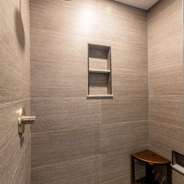 Textured Tile Walk-In Shower with Built-In Niche and Pebble Floor – Newburyport