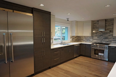 Inspiration for a mid-sized contemporary u-shaped medium tone wood floor kitchen pantry remodel in Vancouver with a double-bowl sink, flat-panel cabinets, dark wood cabinets, quartz countertops, multicolored backsplash, glass tile backsplash, stainless steel appliances and a peninsula