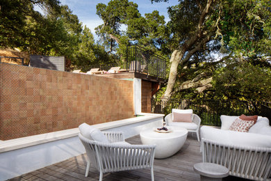 Water fountain deck - mid-sized mediterranean side yard ground level metal railing water fountain deck idea in San Francisco