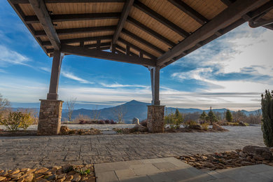 Inspiration for a huge modern full sun courtyard stone landscaping in Charlotte for summer.