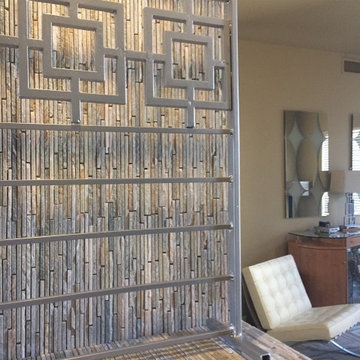 An art shelf provides entrance to the hideaway lounge.
