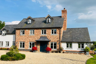 Photo of a medium sized classic porch in Berkshire with a double front door and a black front door.