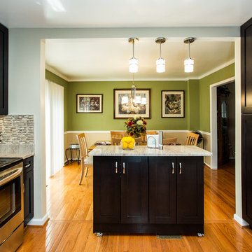 Espresso Kitchen Remodel with Granite Island and Stainless Steel Appliances