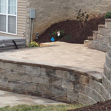 Swimming pool project with retaining walls and patio