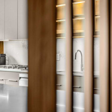 Transform unit into a modern oasis while expanding the kitchen