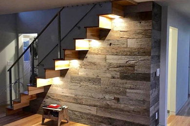 Staircase - mid-sized 1950s wooden floating staircase idea in San Francisco with wooden risers