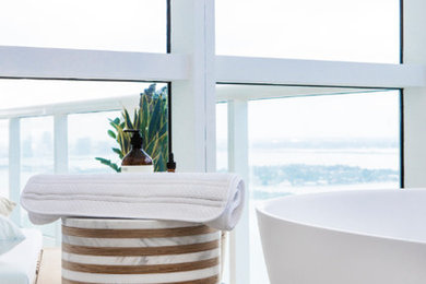 Bathroom - mid-sized contemporary master beige floor bathroom idea in Miami with a hot tub